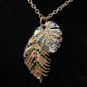 Heidi Klaus “palm leaves” gold tone pendant necklace w/blue & green AB crystals